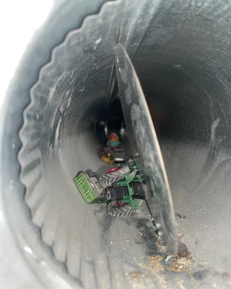 There's my tractor — heavily soiled air duct interior before cleaning