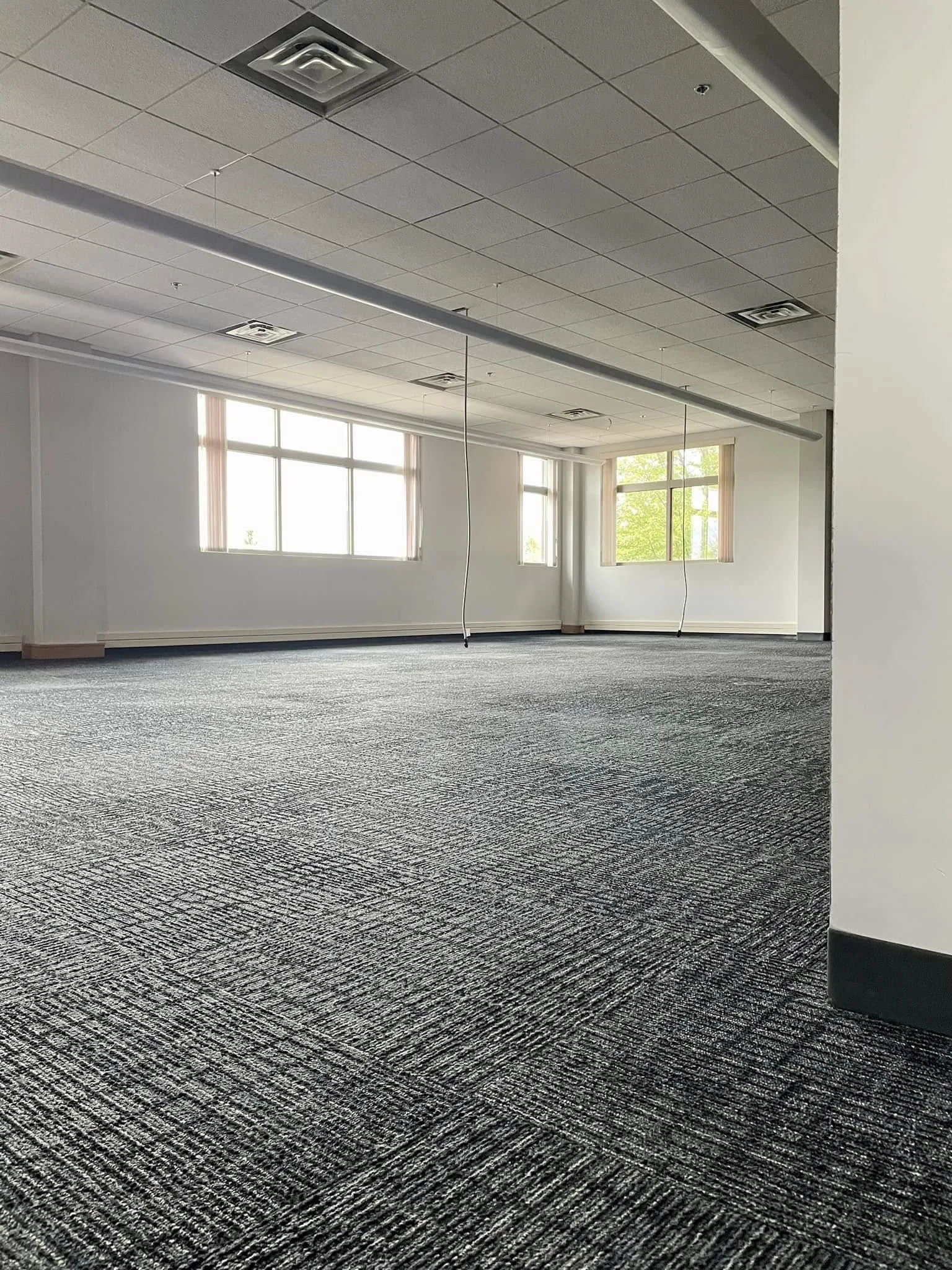 Clean commercial carpet in large office space