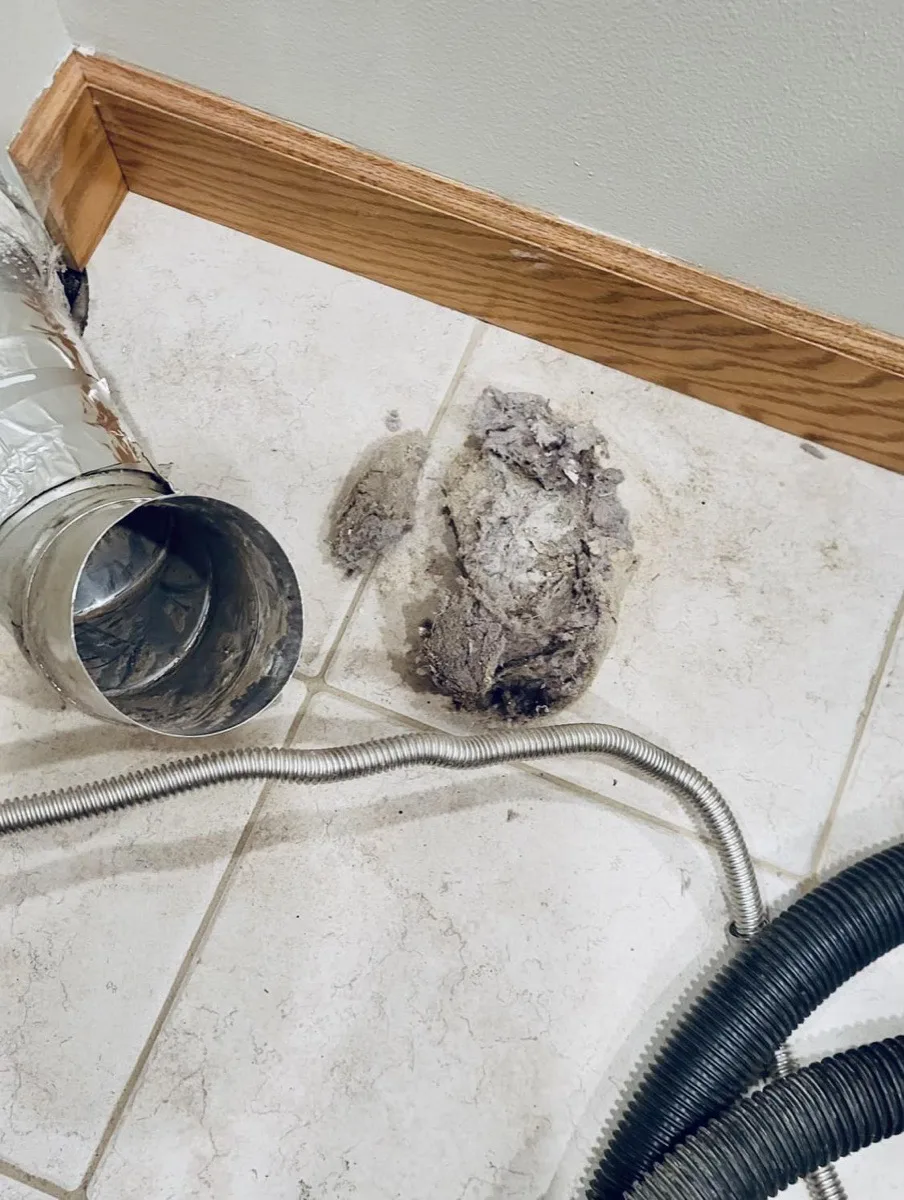 Significant lint buildup removed from a residential dryer vent