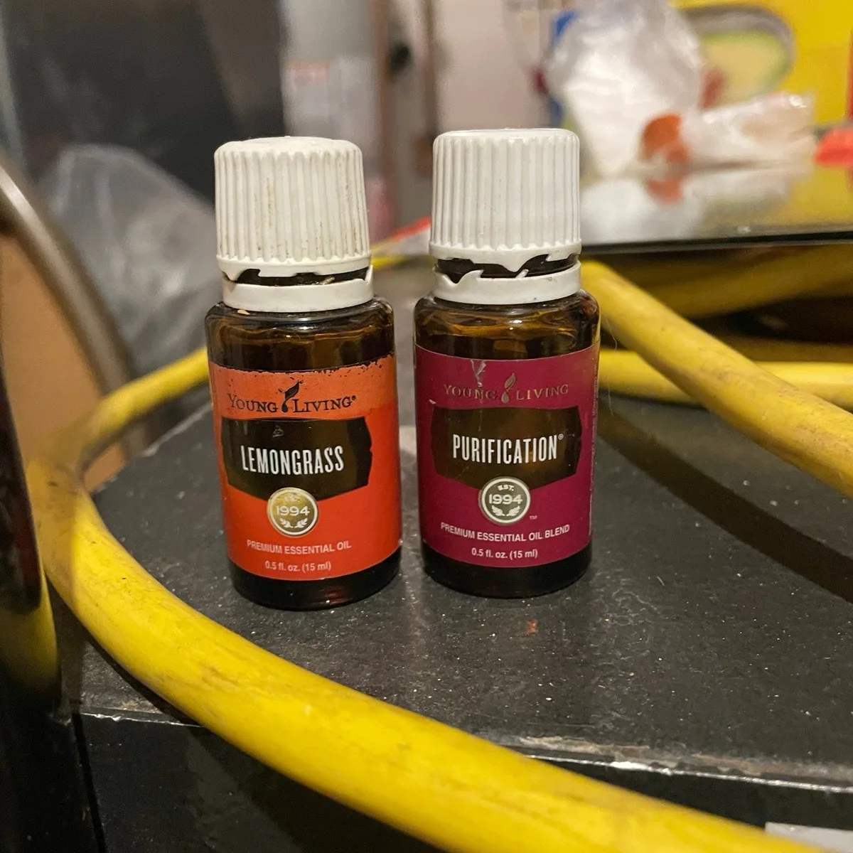 Young Living essential oil bottles used in Four Seasons plant-based cleaning solutions
