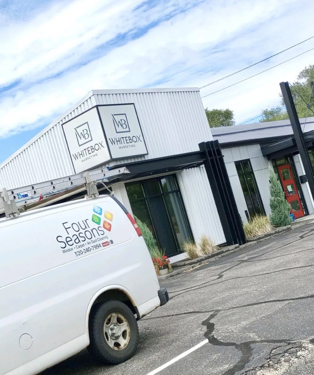 Four Seasons van parked outside a commercial building — Whitebox Marketing, St. Cloud MN