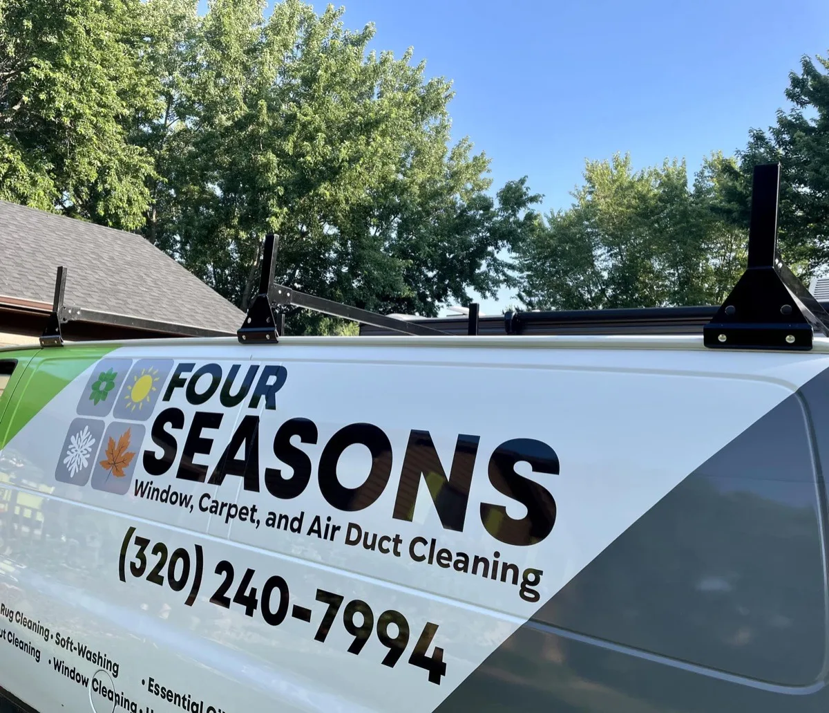 Close-up of Four Seasons service van showing branding details