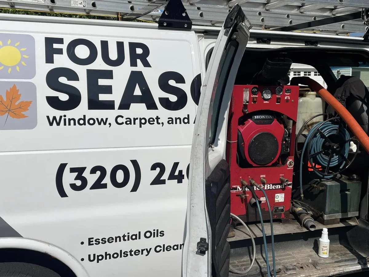 Van interior showing Honda MasterBlend professional carpet cleaning machine and hoses